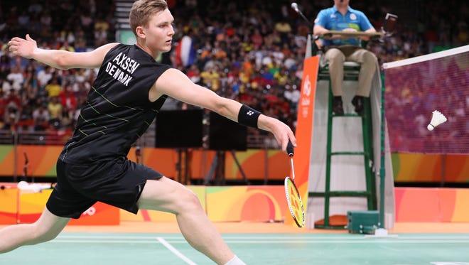 Viktor Axelsen of Denmark competes against Long during men's singles semifinals badminton match at Riocentro - Pavilion 4 during the Rio 2016 Summer Olympic Games.