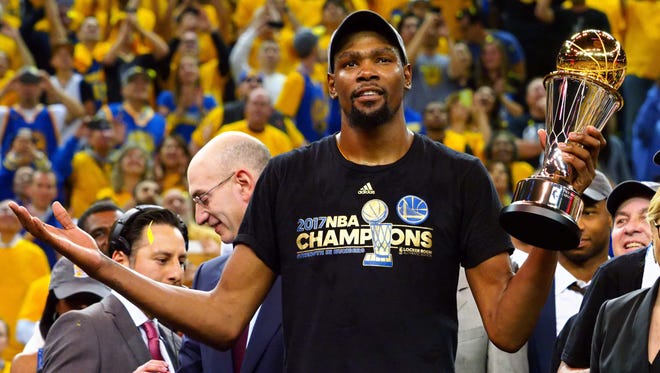 Golden State Warriors forward Kevin Durant (35) celebrates after winning the NBA Fianls MVP in game five of the 2017 NBA Finals at Oracle Arena.