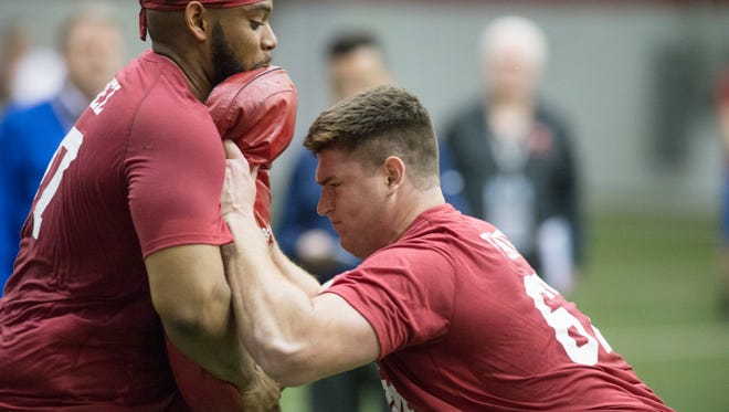 Offensive linemen Dan Feeney, right, and Dimitric Camiel work on a drill during Indiana's pro day at Memorial Stadium and Mellencamp Pavillion, Friday, March 31, 2017, in Bloomington, Ind.
