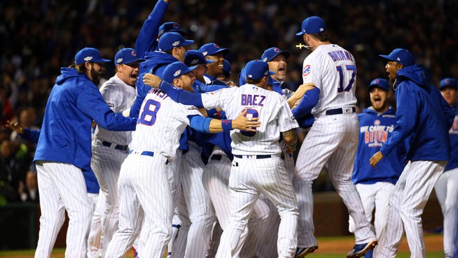 Cubs players celebrate the win.