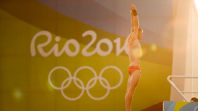American Steele Johnson prepares to dive during the men's 10-meter platform preliminaries