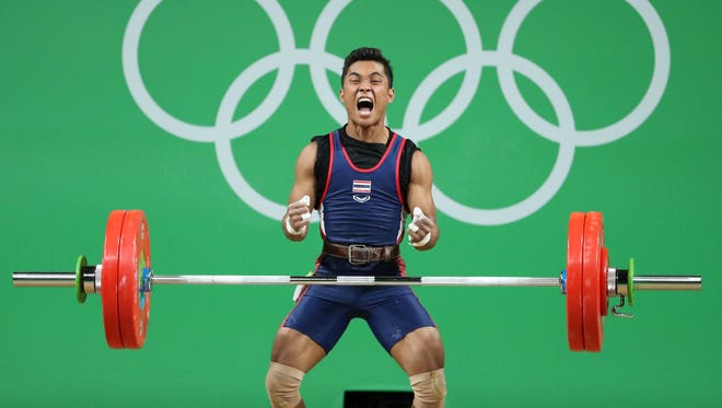 Aug. 7: Sinphet Kruaithong of Thailand was fired up after a successful attempt in the men's 56-kilogram weightlifting competition. Kruaithong went on to win the bronze medal.