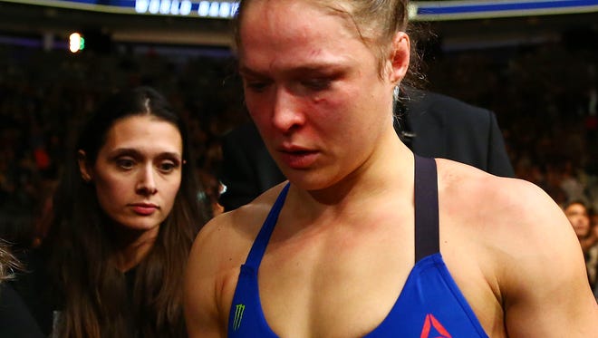 Rousey leaves the ring after her loss at UFC 207.