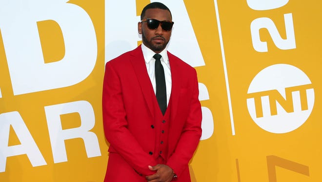 John Wall poses for photos on the red carpet before the 2017 NBA Awards.