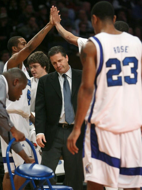 Memphis coach John Calipari waits as his players come in during a timeout in the first half of a Jimmy V Classic basketball game against Southern California on Tuesday, Dec. 4, 2007, at Madison Square Garden in New York.