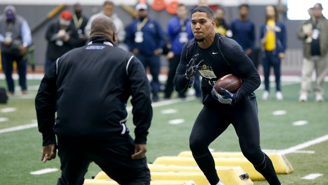 Running back James Conner (24) participates in Pittsburgh's NFL football pro-timing day, Wednesday, March 22, 2017, in Pittsburgh.
