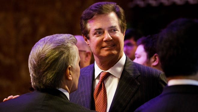 Paul Manafort. then campaign adviser for President Trump, talks with supporters and staff after a speech by Trump on the eve of his Indiana primary victory in New York on May 3, 2016