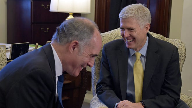 Sen. Bob Casey, D-Pa., shares a laugh with Gorsuch at the beginning of their meeting on Capitol Hill on Feb. 16, 2017.