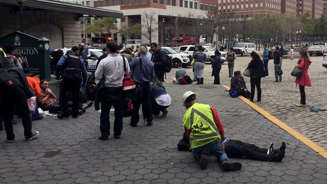 People are treated for their injuries after a N.J. Transit train crashed in to the platform at Hoboken Terminal.