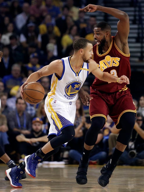 Tristan Thompson guards Stephen Curry during the first half.