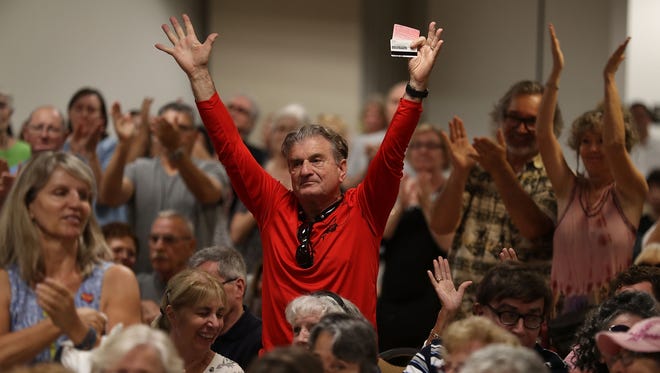Richard Silvestri reacts as Rep. Brian Mast, R-Fla., speaks during a town hall meeting at the Havert L. Fenn Center on Feb. 24, 2017 in Fort Pierce, Fla.