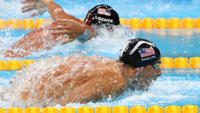 Michael Phelps races Ryan Lochte during the men's 200-meter individual medley.
