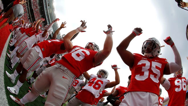 The Ohio State football team gets ready before the annual spring game at Ohio Stadium.
