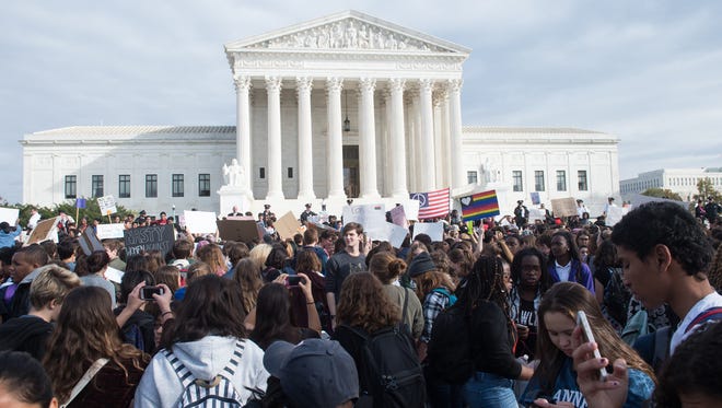 Secondary school students gather in front of the Supreme Court in November to protest Donald Trump's election.