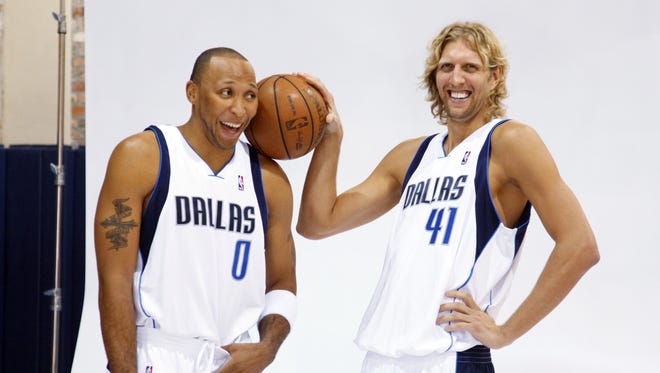 2009: Dallas Mavericks forwards Dirk Nowitzki and Shawn Marion have some fun before a photo session during the Mavericks' media day.