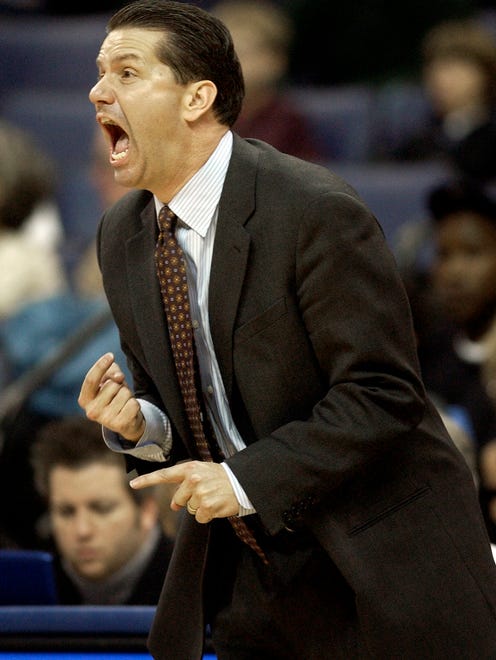 January 9, 2005 - University of Memphis Tigers head basketball coach John Calipari keeps his intensity all the way through the game.  Here he screems for his team with two minutes left in the game with the tigers ahead of Southern Miss in the second half.