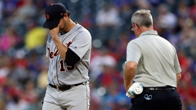 Tigers pitcher Anibal Sanchez (19) reacts after injuring himself during the third inning on Wednesday, Aug. 16, 2017, in Arlington, Texas.