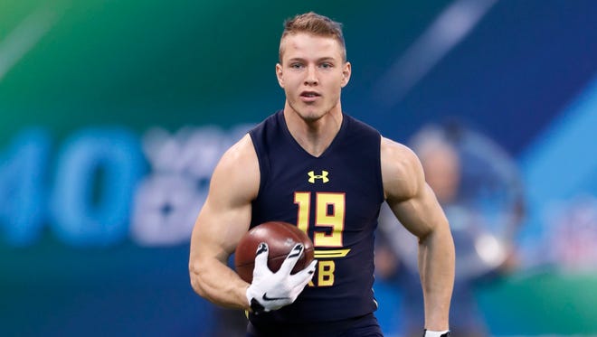Stanford Cardinal running back Christian McCaffrey goes through workout drills during the 2017 NFL Combine at Lucas Oil Stadium.