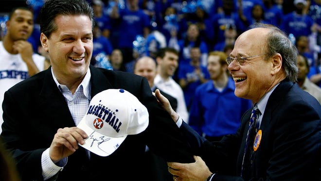 January 2, 2008 - Memphis head coach John Calipari, left, receives a hat signed by President George W. Bush from U.S. House of Representatives Steven Cohen-D, before the Tigers game against UTEP.