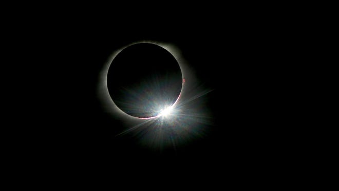 The diamond ring appears as the moon starts to move away from totality during the total solar eclipse in Murfreesboro, Tenn.