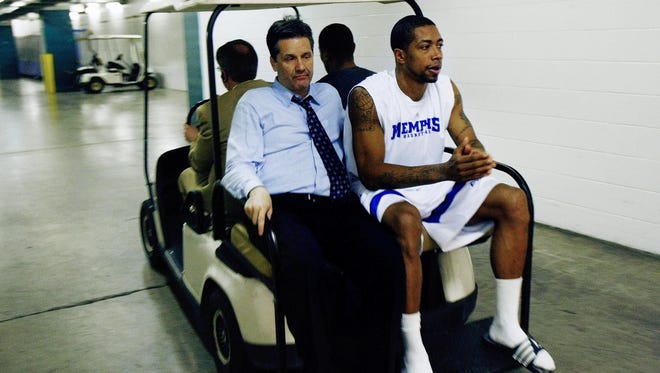 April 7, 2008 - Memphis haed coach John Calipari and Antonio Anderson, right, take a cart ride to the interview session after losing to Kansas 75-68 during NCAA Championship game in San Antonio.