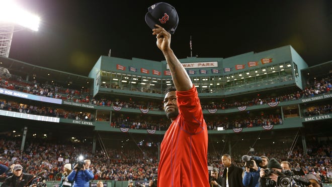 ALDS, Game 3: David Ortiz salutes the Red Sox fans at Fenway Park after losing to the Indians 4-3 in his final game in uniform.