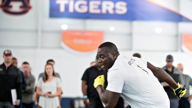 Defensive tackle Montravius Adams (1) works out during Auburn's football Pro Day, Friday, March 10, 2017, in Auburn, Ala.