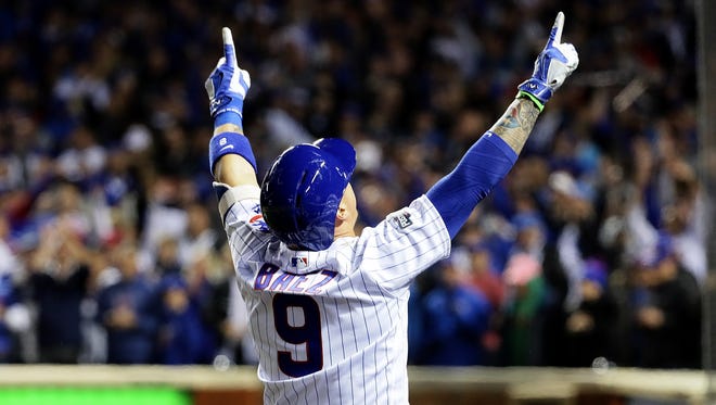 NLDS, Game 1: Javier Baez celebrates after hitting a home run in the eighth inning off Johnny Cueto that gives the Cubs a 1-0 lead and eventual victory.