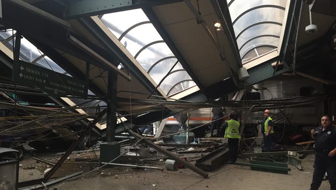 A N.J. Transit train seen through the wreckage after it crashed in to the platform at the Hoboken Terminal.
