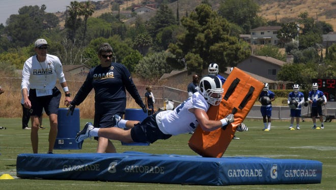 Los Angeles Rams safety Cody Davis (38) participates in tackling drills as special teams coach John Fassel watches during organized team activities at Cal Lutheran University.