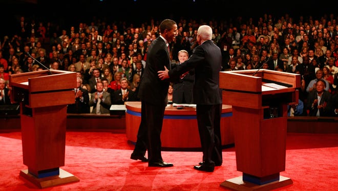 Barack Obama and John McCain shake hands after taking part in the first of three debates on Sept. 26, 2008, at the University of Mississippi in Oxford, Miss.