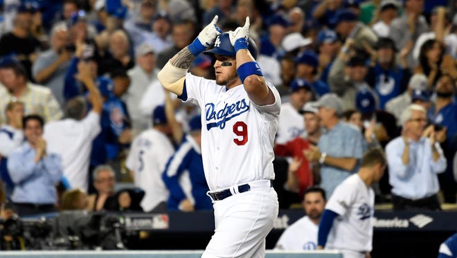 NLCS, Game 3: Dodgers' Yasmani Grandal hits a two-run homer off Cubs starter Jake Arrieta in the fourth inning to extend his team's lead to 3-0 in the eventual 6-0 win.
