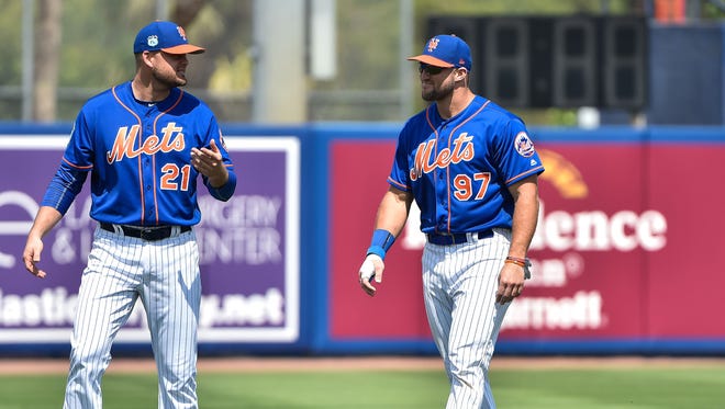 March 9: Tim Tebow (right) talks with Mets first baseman Lucas Duda.