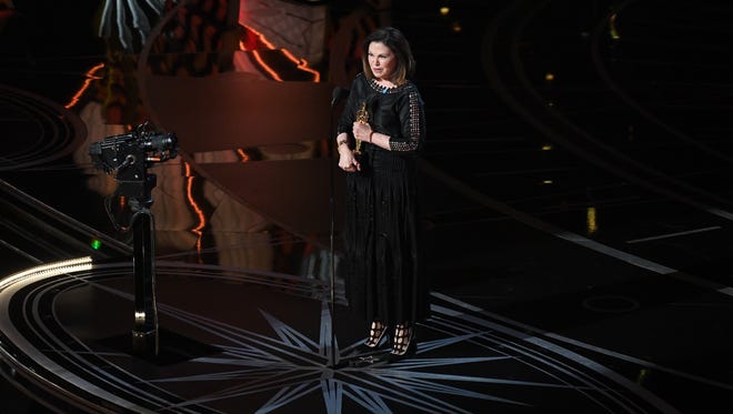 Colleen Atwood accepts the Oscar for Achievement in costume design for 'Fantastic Beasts and Where to Find Them' during the 89th Academy Awards.