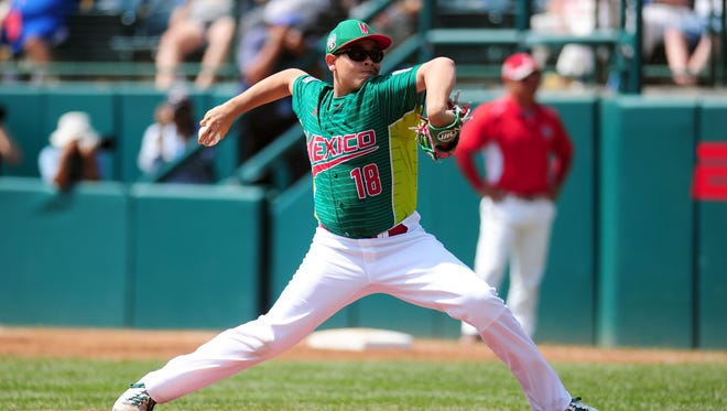 Mexico pitcher Jorge Garcia delivers during the first inning against Japan.