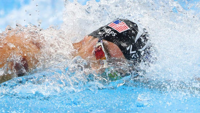 Michael Phelps swims during the men's 4x100m freestyle relay final.