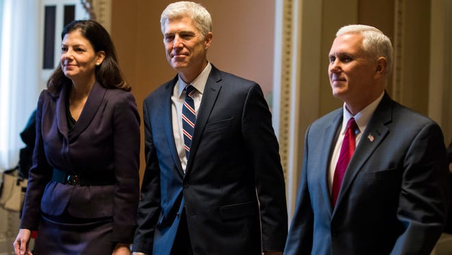 Gorsuch is accompanied by former senator Kelly Ayotte and Vice President Pence in a visit to Capitol Hill on Feb. 1, 2017.