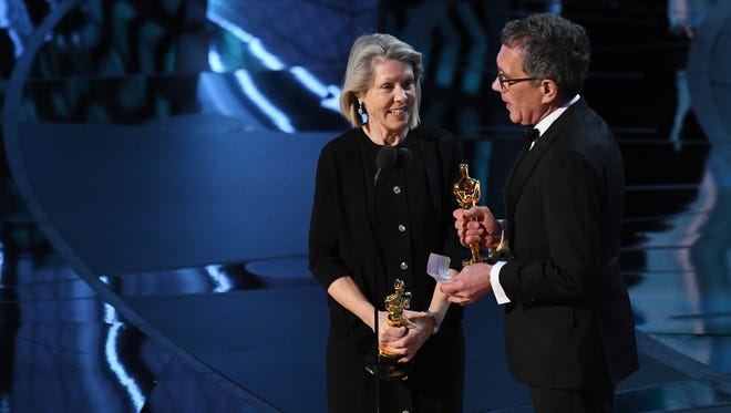 Sandy Reynolds-Wasco and David Wasco accept the award 'La La Land' during the 89th Academy Awards.