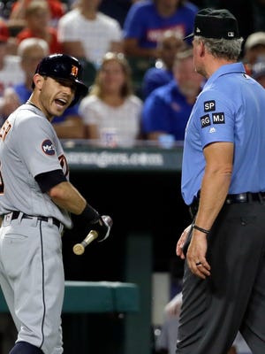 Detroit Tigers second baseman Ian Kinsler, left, argues with crew chief Ted Barrett, right, after Kinsler was ejected by home plate umpire Angel Hernandez in the fifth inning against the Texas Rangers on Aug. 14, 2017.