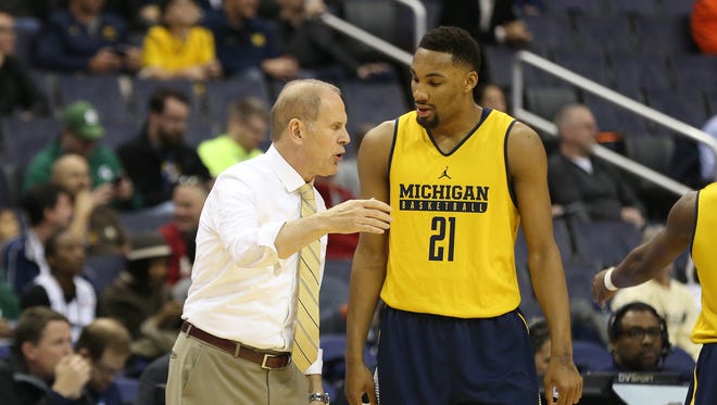 Michigan coach John Beilein talks to guard Zak Irvin in the first half of U-M's 75-55 win over Illinois during the Big Ten tournament Thursday, March 9, 2017 in Washington.