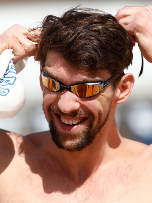 Olympic gold medalist Michael Phelps puts on his goggles for a practice session at the Arena Pro Swim Series on at Skyline Aquatic Center on April 15.