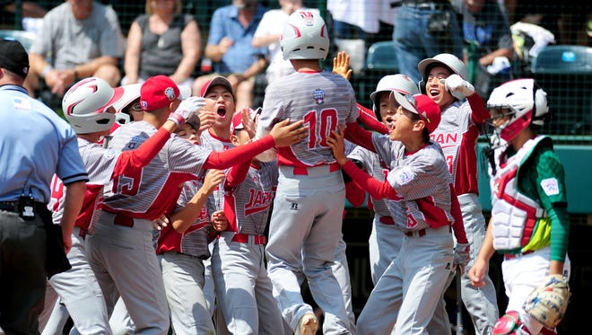 Japan hitter Keitaro Miyahara (10) celebrates after his first-inning home run against Mexico.