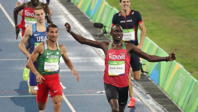 David Lekuta Rudisha of Kenya celebrates after winning the men's 800-meter final. To the left is the USA's Clayton Murphy, who came in third.