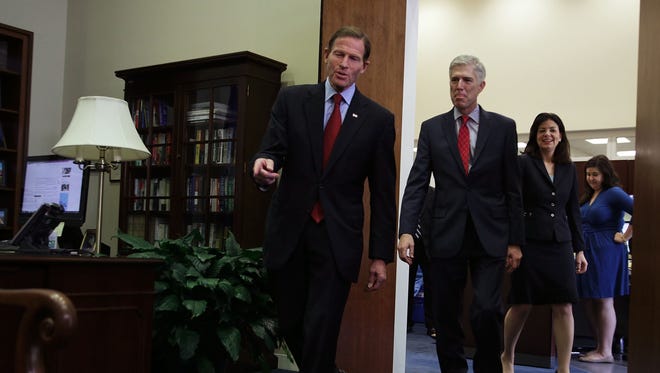 Gorsuch arrives with former senator Kelly Ayotte at the office of Sen. Richard Blumenthal, D-Conn., on Capitol Hill on Feb. 8, 2017.