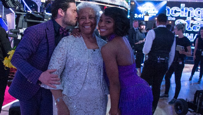 Normani Kordei's grandmother receives a kiss from Val Chmerkovskiy.