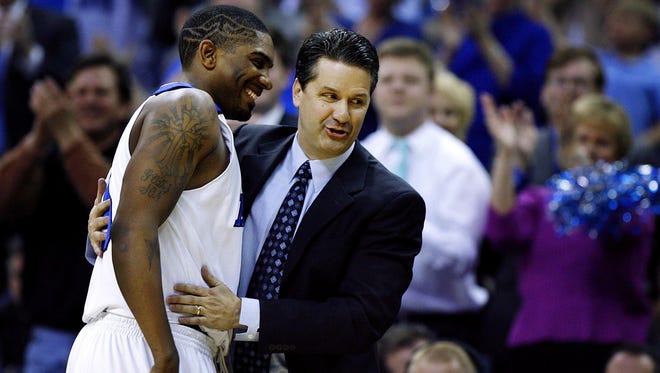 February 20, 2007 - Memphis' Jeremy Hunt, left, is congradulated by head coach John Calipari, right, after he scored his 1000th career point against Rice.