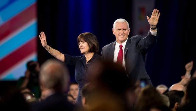 Vice President Mike Pence and Second Lady Karen Pence wave to the audience as they leave the stage at the Annual Conservative Political Action Conference.