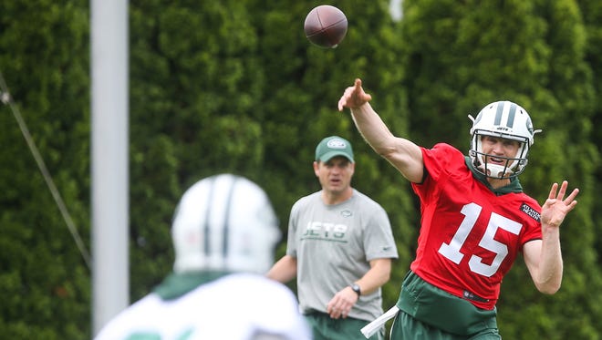 New York Jets quarterback Josh McCown (15) throws a pass during organized team activities at the Atlantic Health Jets Training Center.