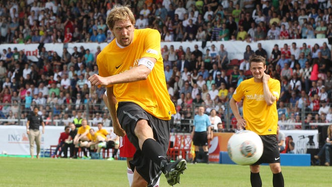 2013: Dirk Nowitzki scores a penalty kick during a charity soccer match.