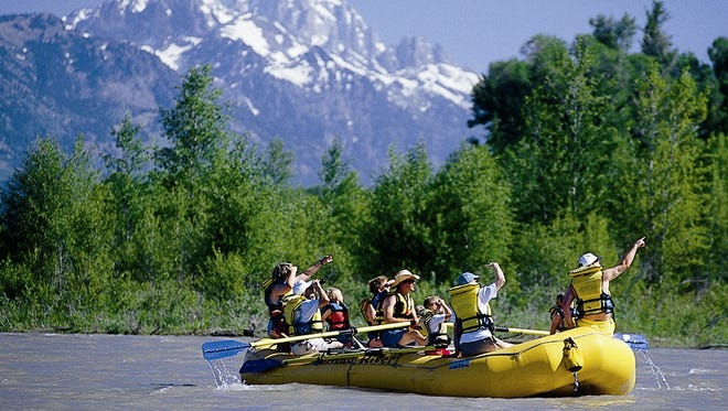 View the eclipse from the Snake River near Jackson Hole, Wyoming on a white water rafting trip with Mad River Boat Trips.